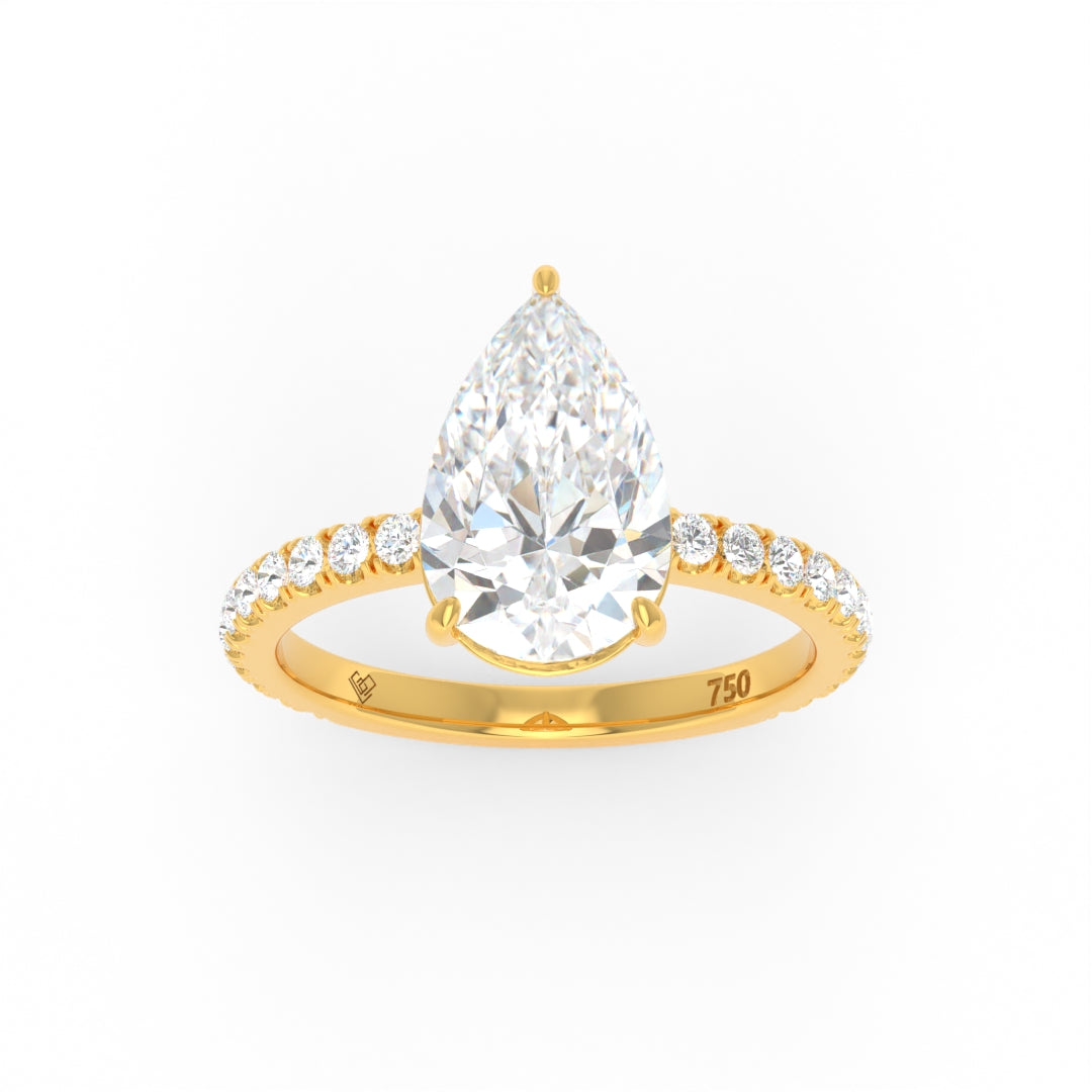 Abigail pear engagement ring with pear cut diamond and diamond band in gold setting
