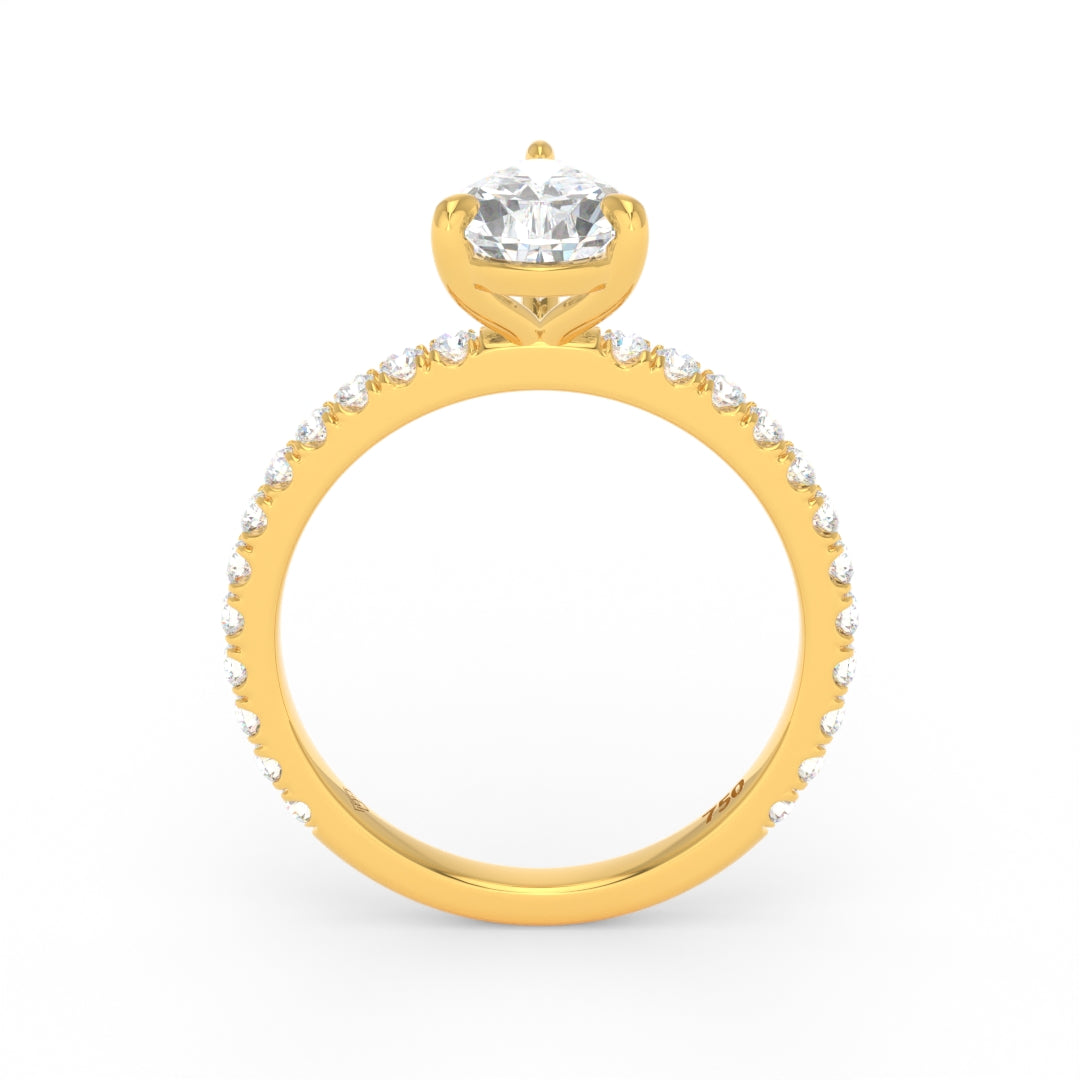 Abigail pear engagement ring with pear cut diamond and diamond band in yellow gold setting