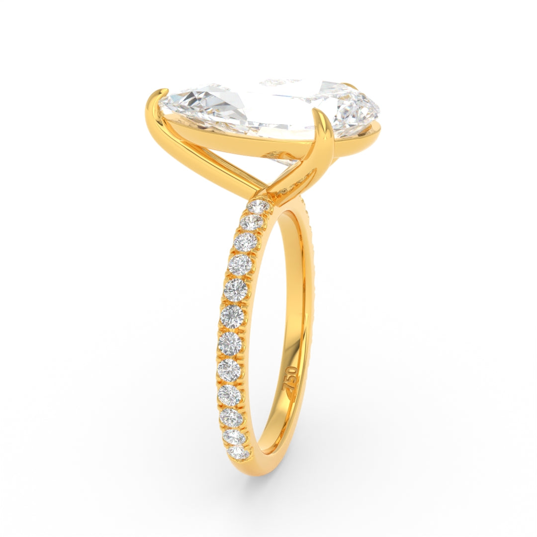 Abigail pear engagement ring with pear cut solitaire diamond and diamond band in gold setting