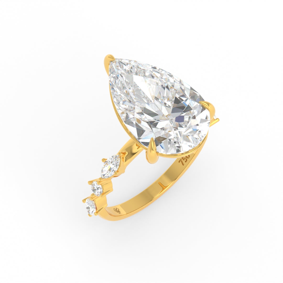 Elizabeth Pear Cut Diamond Engagement Ring With A Marquise And Round Cut Diamond Band