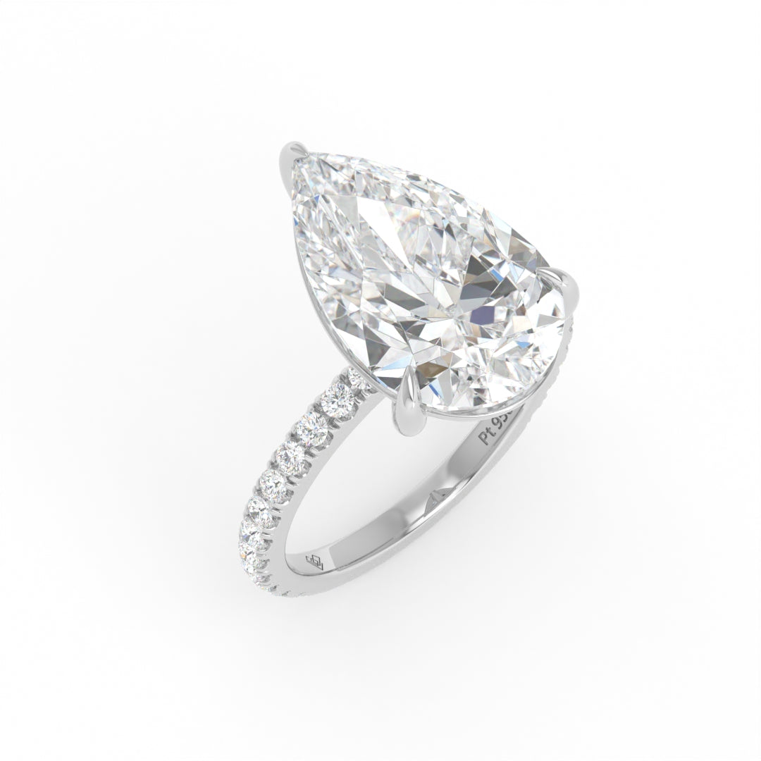 Abigail pear engagement ring with pear cut solitaire diamond and diamond band in platinum setting