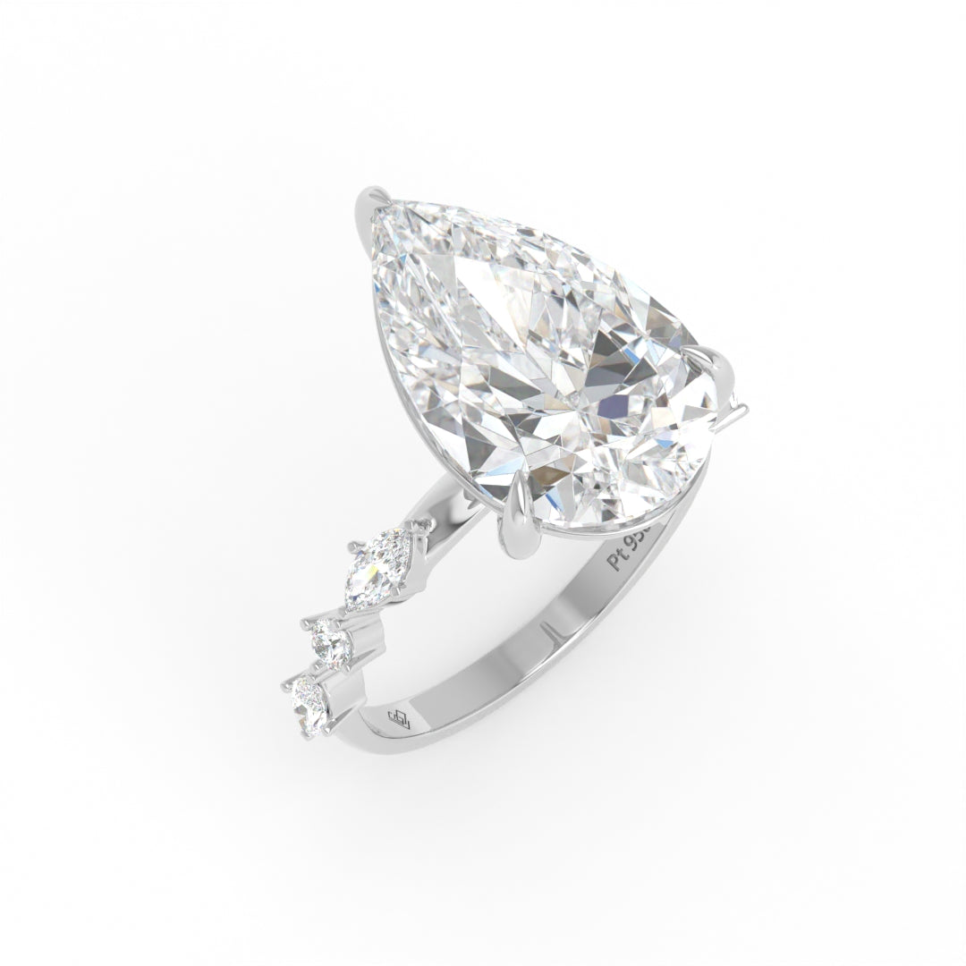 Elizabeth Pear Cut Diamond Engagement Ring With A Marquise And Round Cut Diamond Band