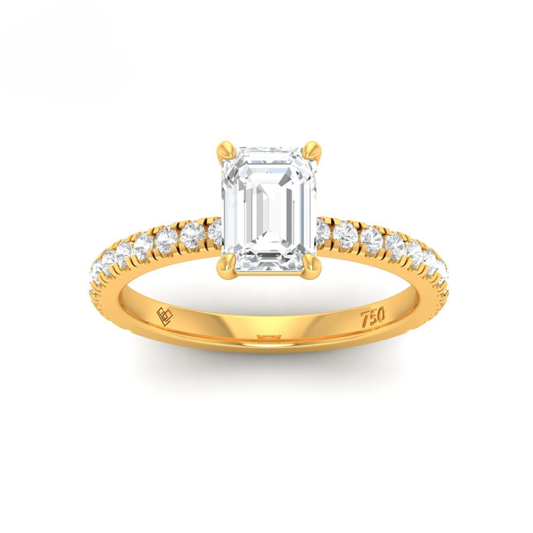 Gold engagement ring with emerald cut solitaire diamond and diamond-studded band