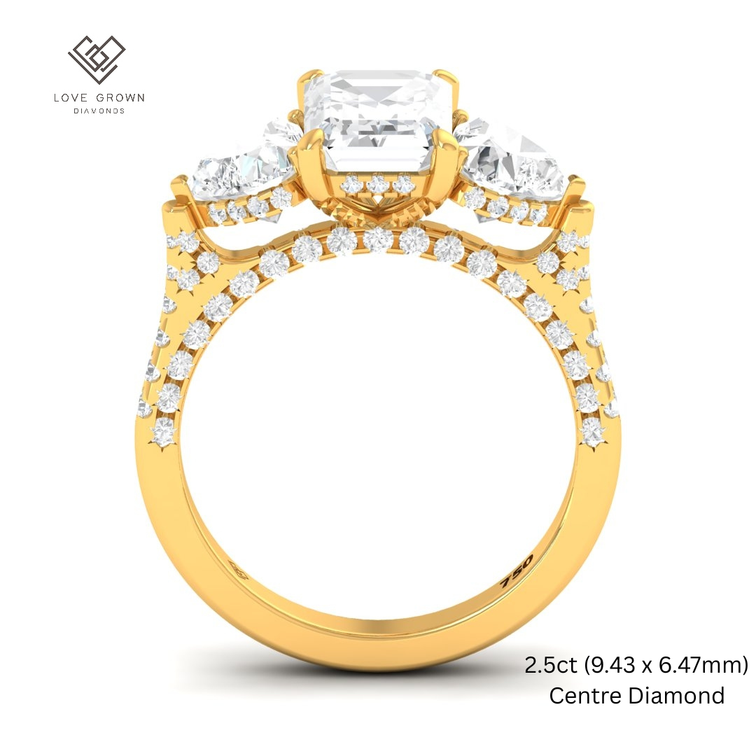 Victoria Emerald Cut Diamond Engagement Ring with Heart Cut Side Diamonds and 3D Diamond Band