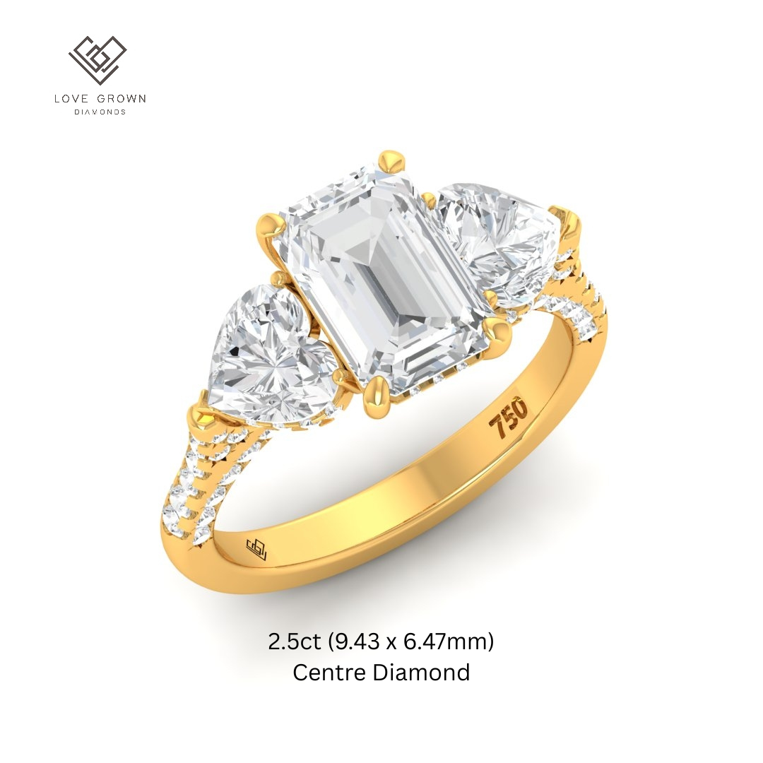 Victoria Emerald Cut Diamond Engagement Ring with Heart Cut Side Diamonds and 3D Diamond Band