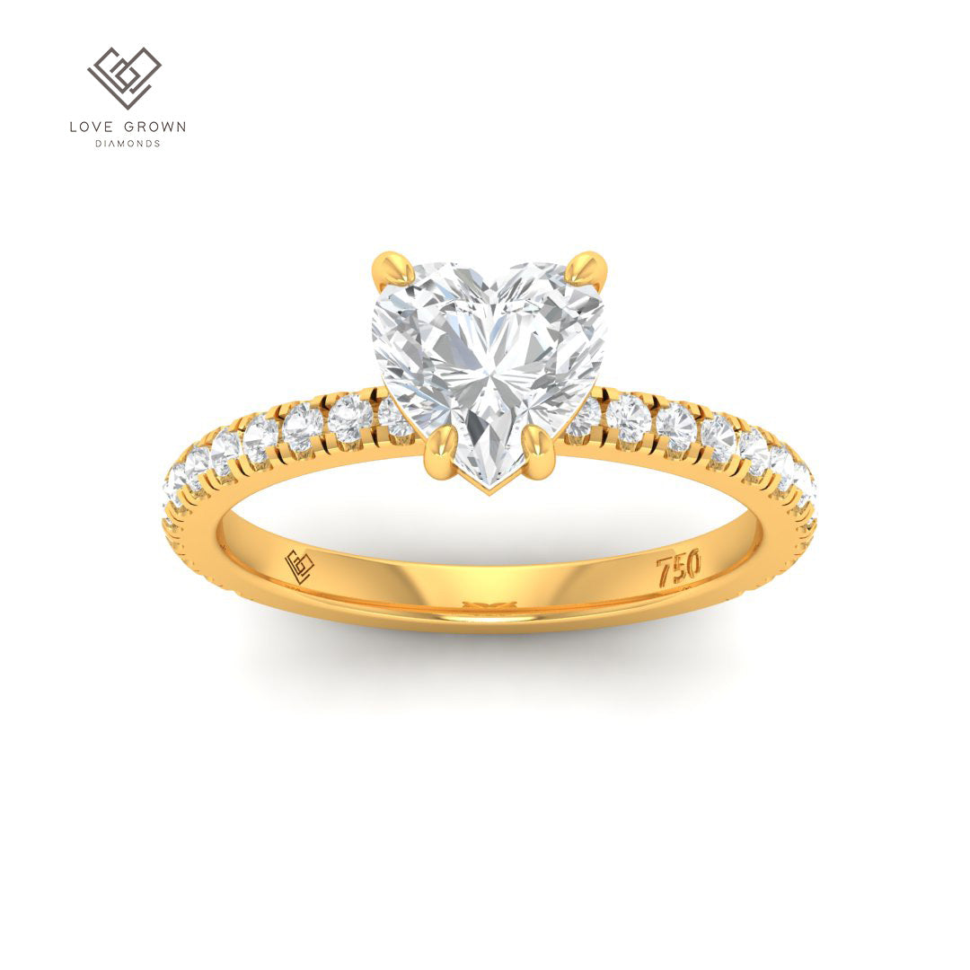 Heart-shaped diamond engagement ring with a platinum 4-claw mount and diamond band.