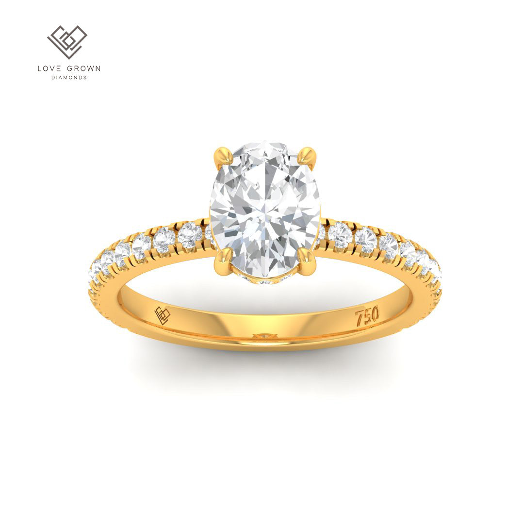 Chloé Oval Cut Diamond engagement ring with hidden halo and diamond band in gold.