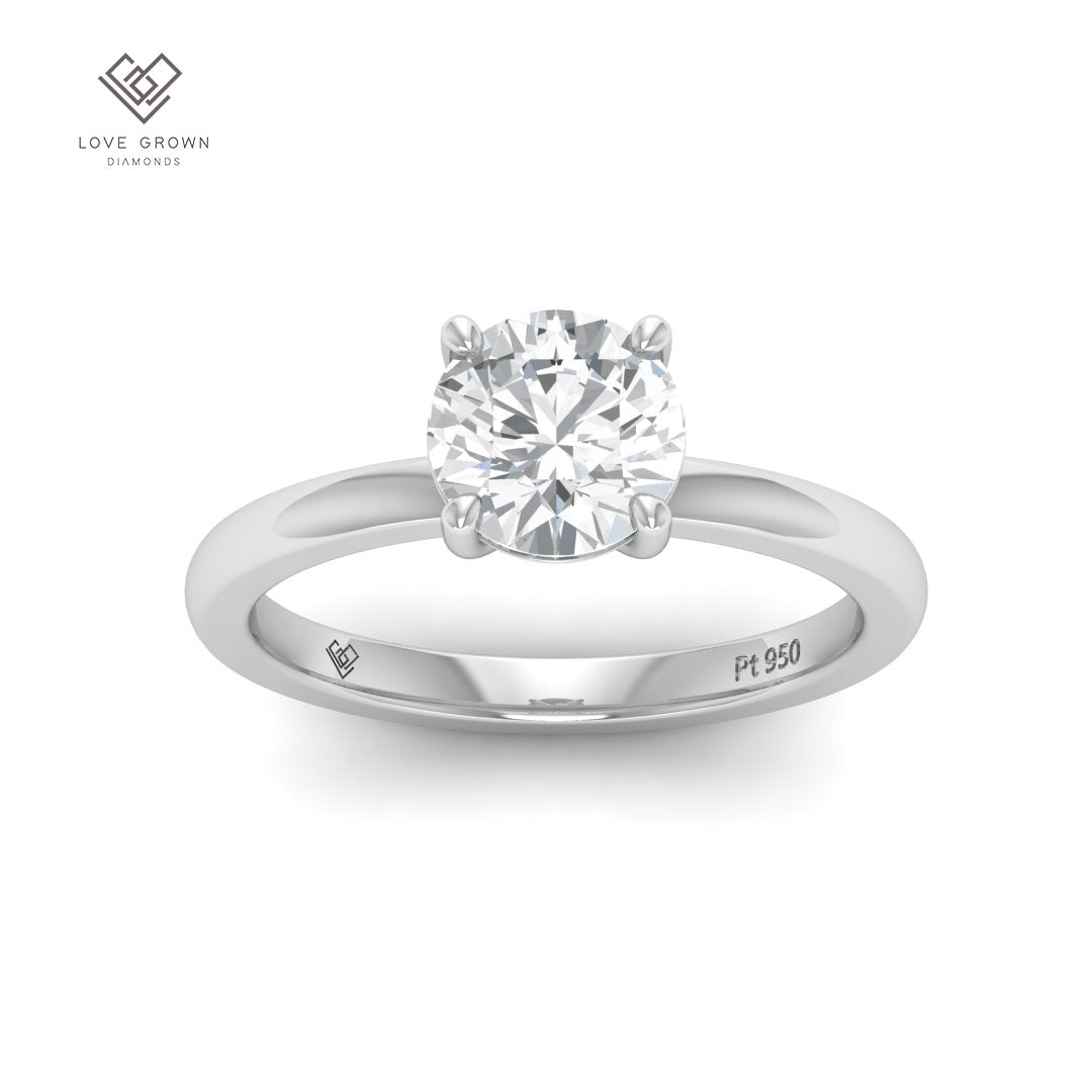 Noémie Solitaire Round Cut Diamond Engagement Ring in Platinum or Gold.