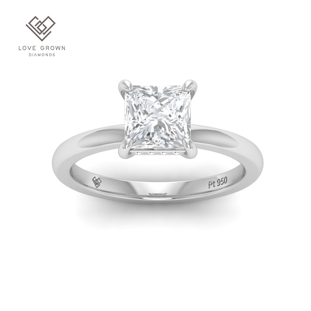Léa princess cut diamond engagement ring with hidden halo in platinum setting.