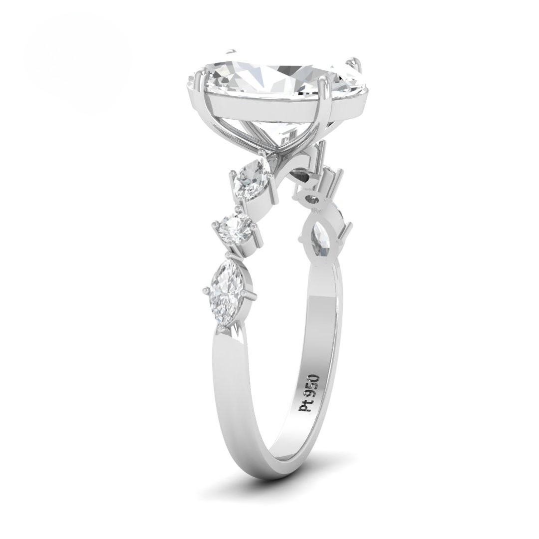 Elizabeth Oval Cut Diamond Engagement Ring With A Marquise And Round Cut Diamond Band.
