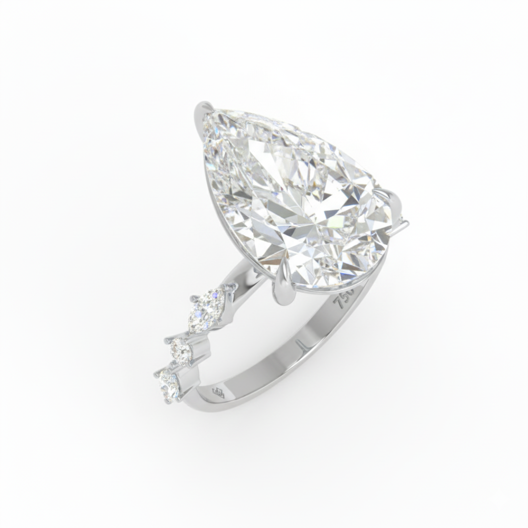 Elizabeth Pear Cut Diamond Engagement Ring With A Marquise And Round Cut Diamond Band