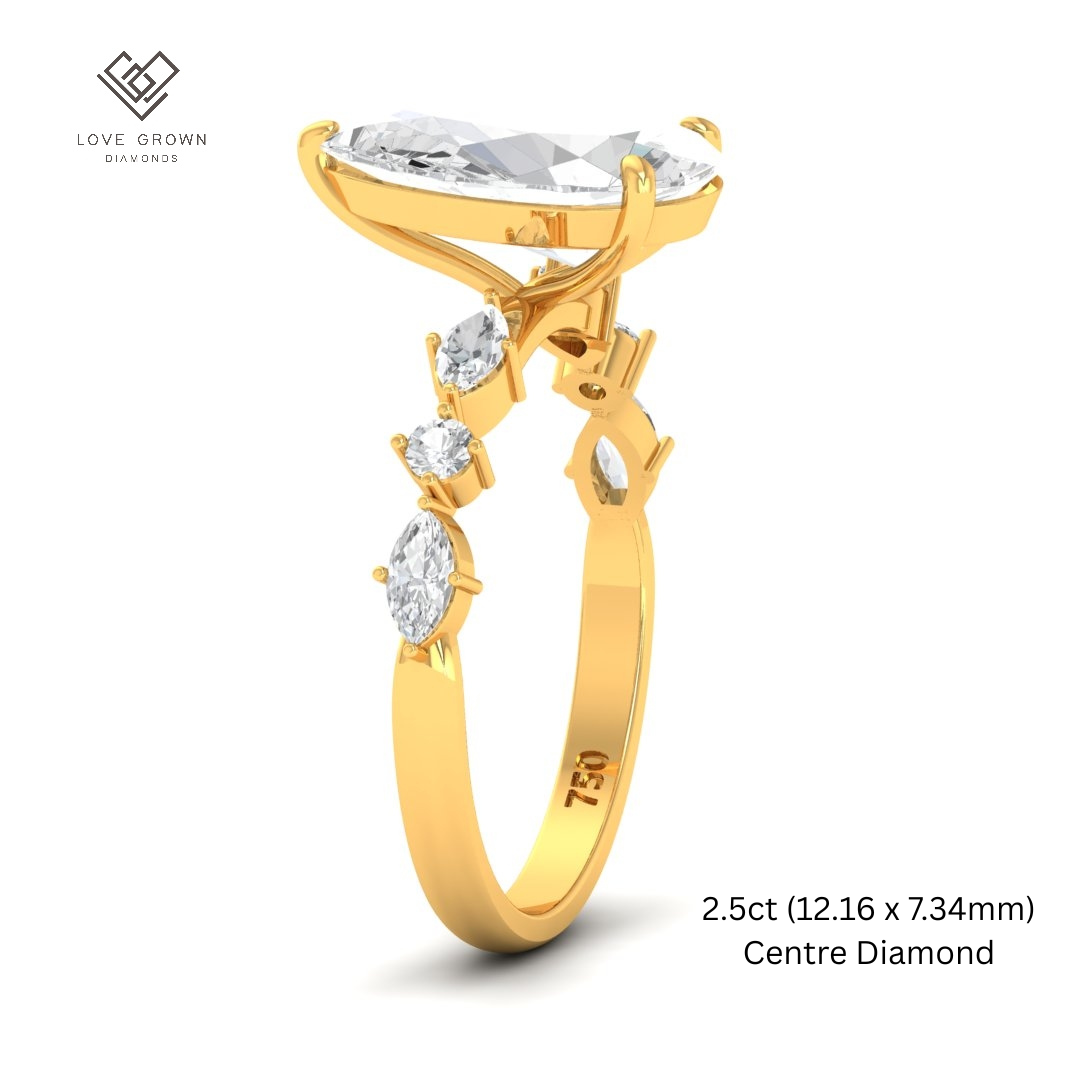 Elizabeth Pear Cut Diamond Engagement Ring With A Marquise And Round Cut Diamond Band