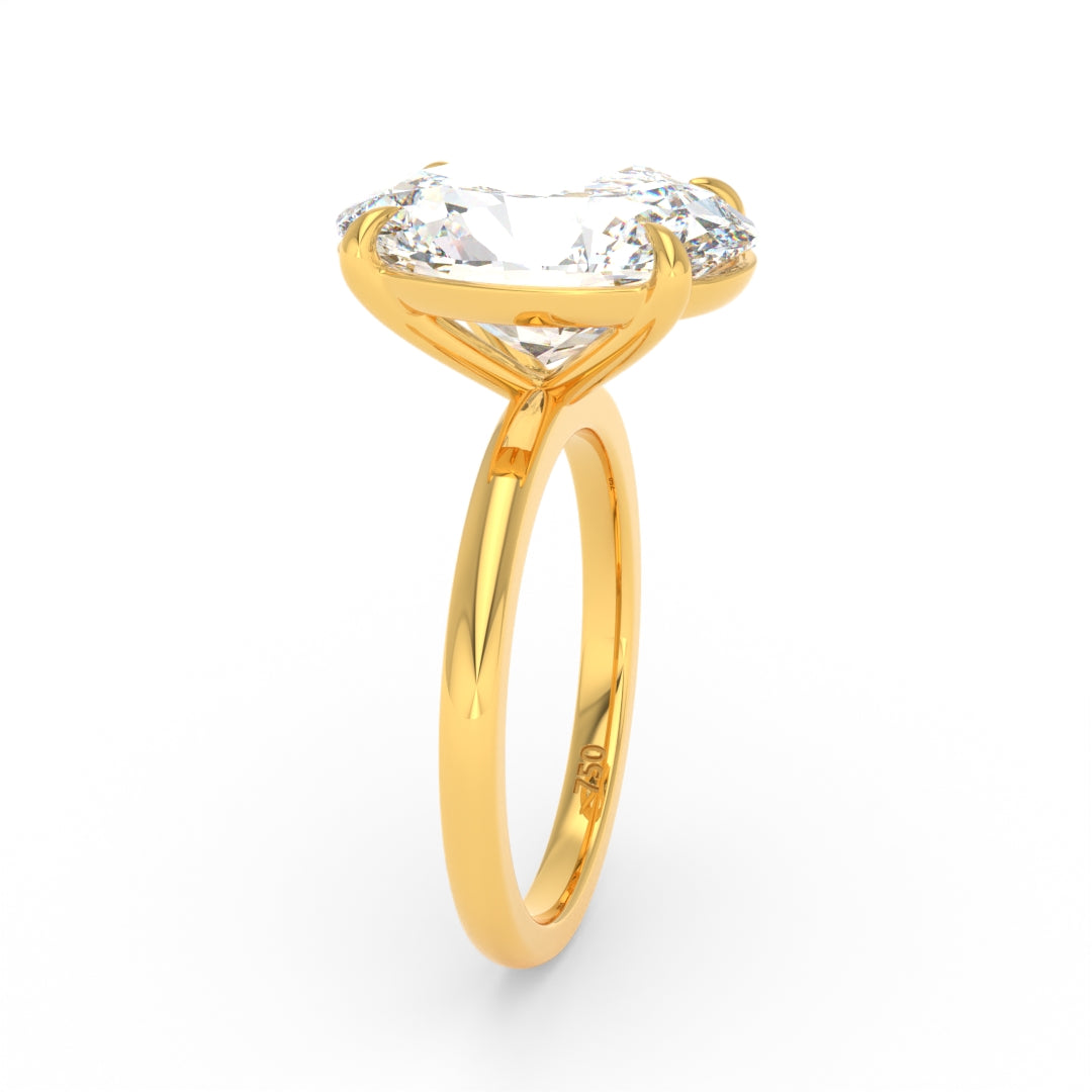 Solitaire Oval cut diamond engagement ring with 18k yellow gold band and four-claw setting