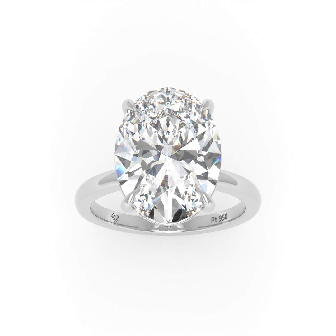 Solitaire Oval cut diamond engagement ring with platinum band and four-claw setting