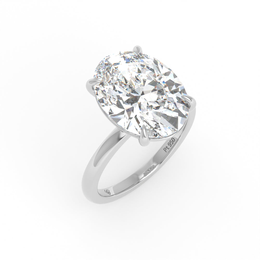 Solitaire Oval cut diamond engagement ring with platinum band and four-claw setting