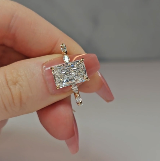 Kasandra Radiant Cut Diamond Engagement Ring With A Marquise Cut Diamond Band