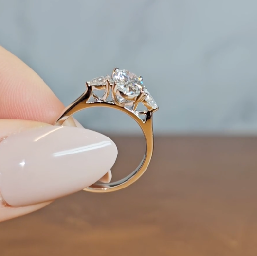 Sofia Oval Cut Diamond Engagement Ring With A Pear Cut Side Diamonds