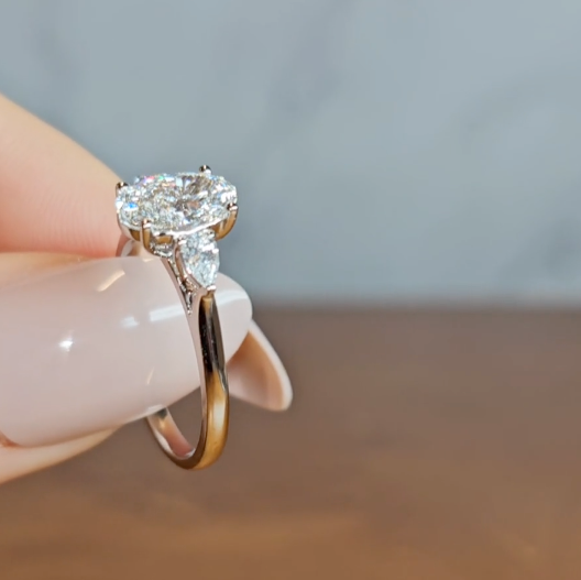 Sofia Oval Cut Diamond Engagement Ring With A Pear Cut Side Diamonds
