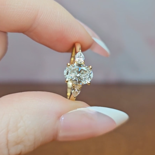 Sofia Oval Cut Diamond Engagement Ring With A Pear Cut Side Diamonds