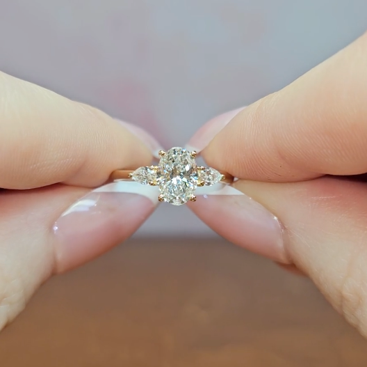 Sofia Oval Cut Diamond Engagement Ring With A Pear Cut Side Diamonds