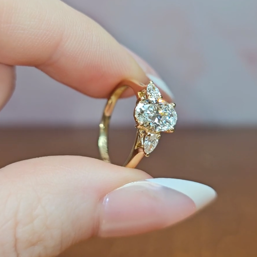 Sofia Oval Cut Diamond Engagement Ring With A Pear Cut Side Diamonds