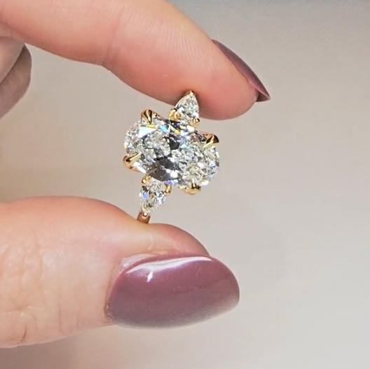 Sofia Oval Cut Diamond Engagement Ring With A Pear Cut Side Diamonds