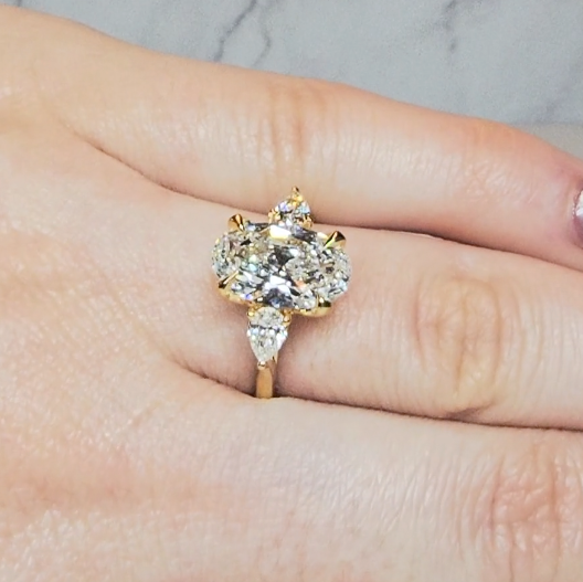 Sofia Oval Cut Diamond Engagement Ring With A Pear Cut Side Diamonds