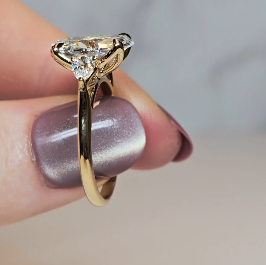 Sofia Oval Cut Diamond Engagement Ring With A Pear Cut Side Diamonds
