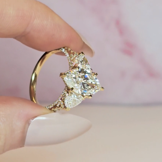 Victoria Marquise Cut Diamond Engagement Ring with Heart Cut Side Diamonds and 3D Diamond Band
