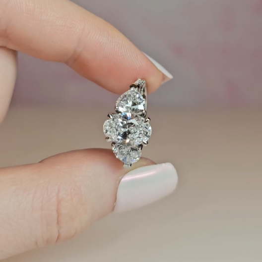 Victoria Oval Cut Diamond Engagement Ring with Heart Cut Side Diamonds and 3D Diamond Band