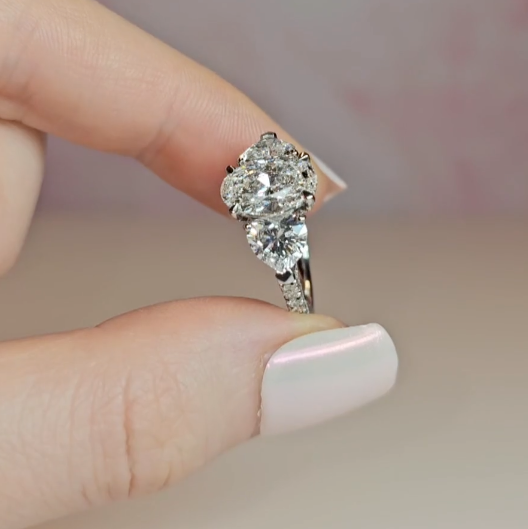 Victoria Oval Cut Diamond Engagement Ring with Heart Cut Side Diamonds and 3D Diamond Band