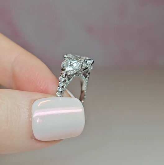 Victoria Oval Cut Diamond Engagement Ring with Heart Cut Side Diamonds and 3D Diamond Band