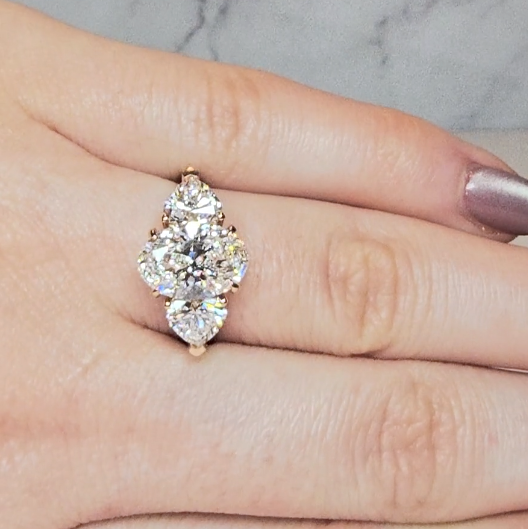 Victoria Oval Cut Diamond Engagement Ring with Heart Cut Side Diamonds and 3D Diamond Band