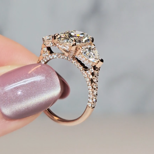 Victoria Oval Cut Diamond Engagement Ring with Heart Cut Side Diamonds and 3D Diamond Band