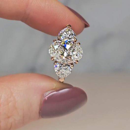 Victoria Oval Cut Diamond Engagement Ring with Heart Cut Side Diamonds and 3D Diamond Band