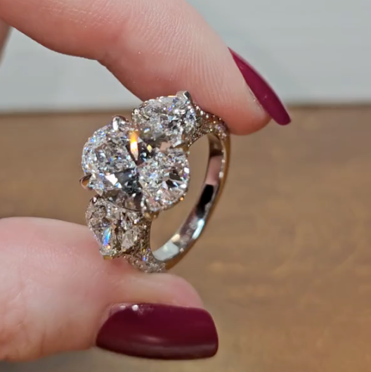 Victoria Oval Cut Diamond Engagement Ring with Heart Cut Side Diamonds and 3D Diamond Band