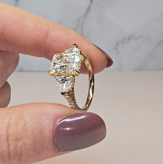 Victoria Radiant Cut Diamond Engagement Ring with Heart Cut Side Diamonds and 3D Diamond Band