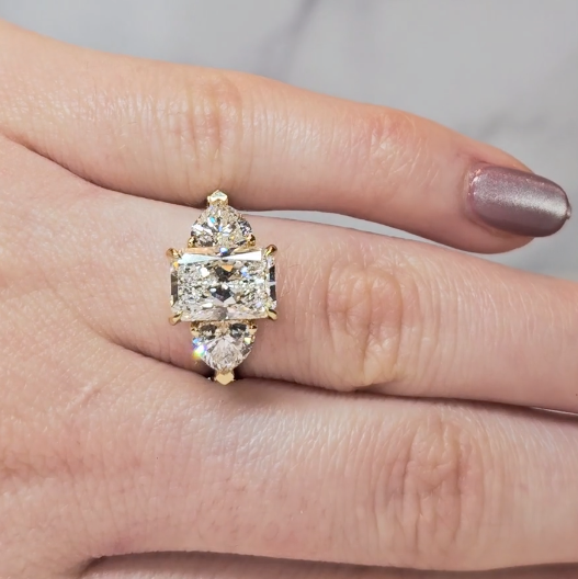 Victoria Radiant Cut Diamond Engagement Ring with Heart Cut Side Diamonds and 3D Diamond Band