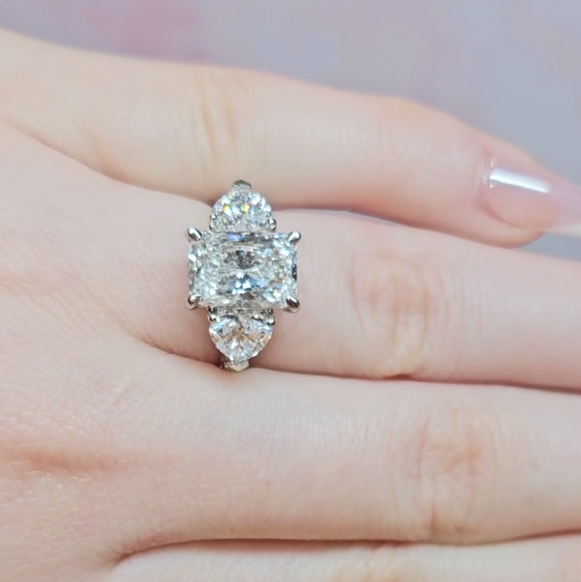 Victoria Radiant Cut Diamond Engagement Ring with Heart Cut Side Diamonds and 3D Diamond Band