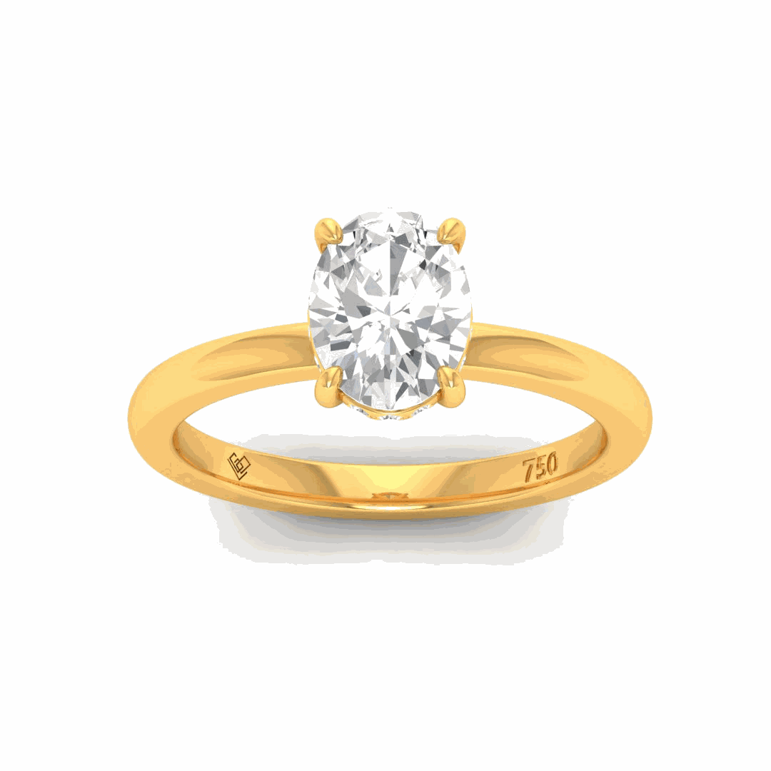 Léa oval cut diamond engagement ring with hidden halo set in 18k yellow gold band