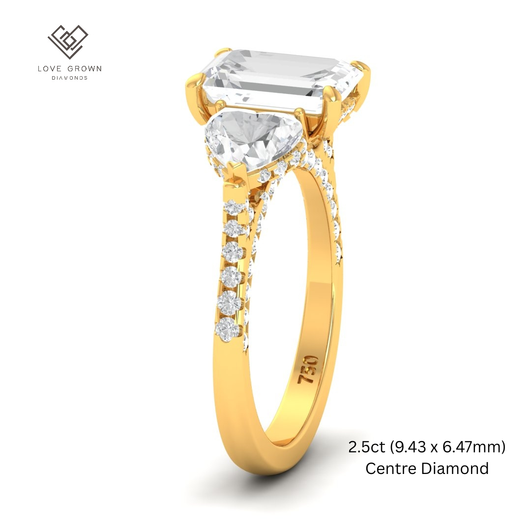 Victoria Emerald Cut Diamond Engagement Ring with Heart Cut Side Diamonds and 3D Diamond Band
