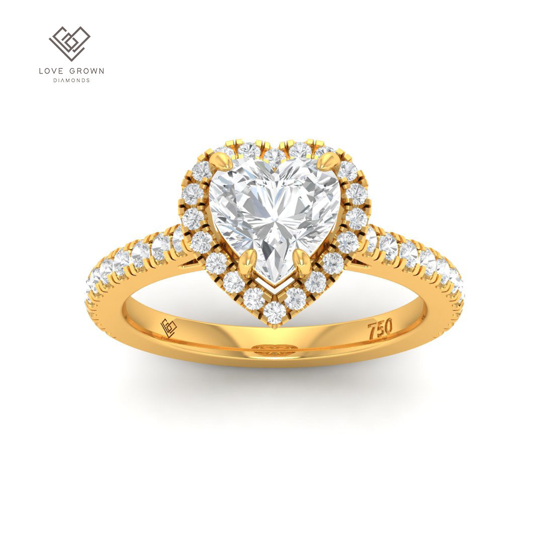 Bella heart cut diamond engagement ring with diamond halo and band in gold.