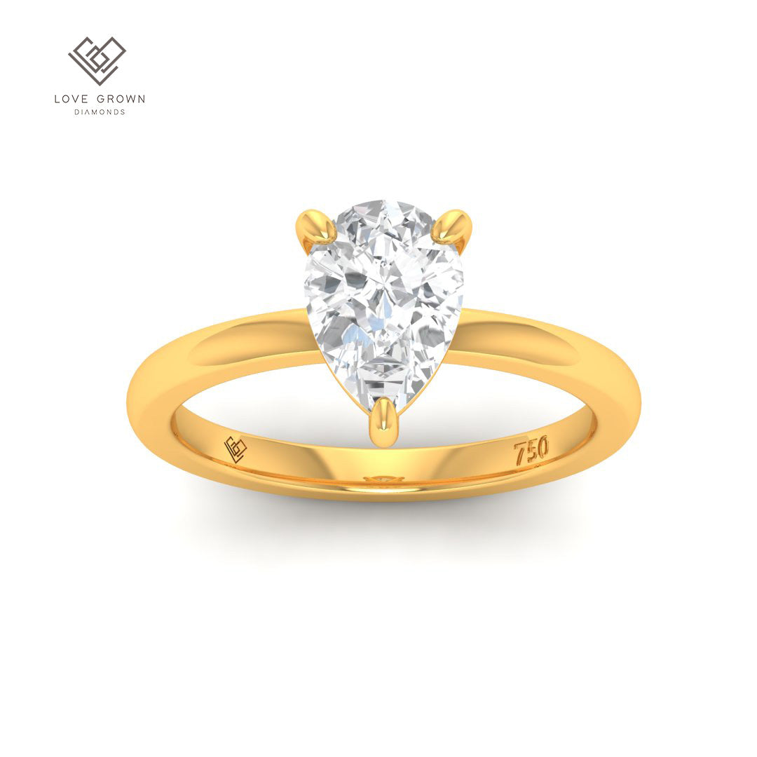 Noémie Solitaire Pear Cut Diamond Engagement Ring in Gold Band.
