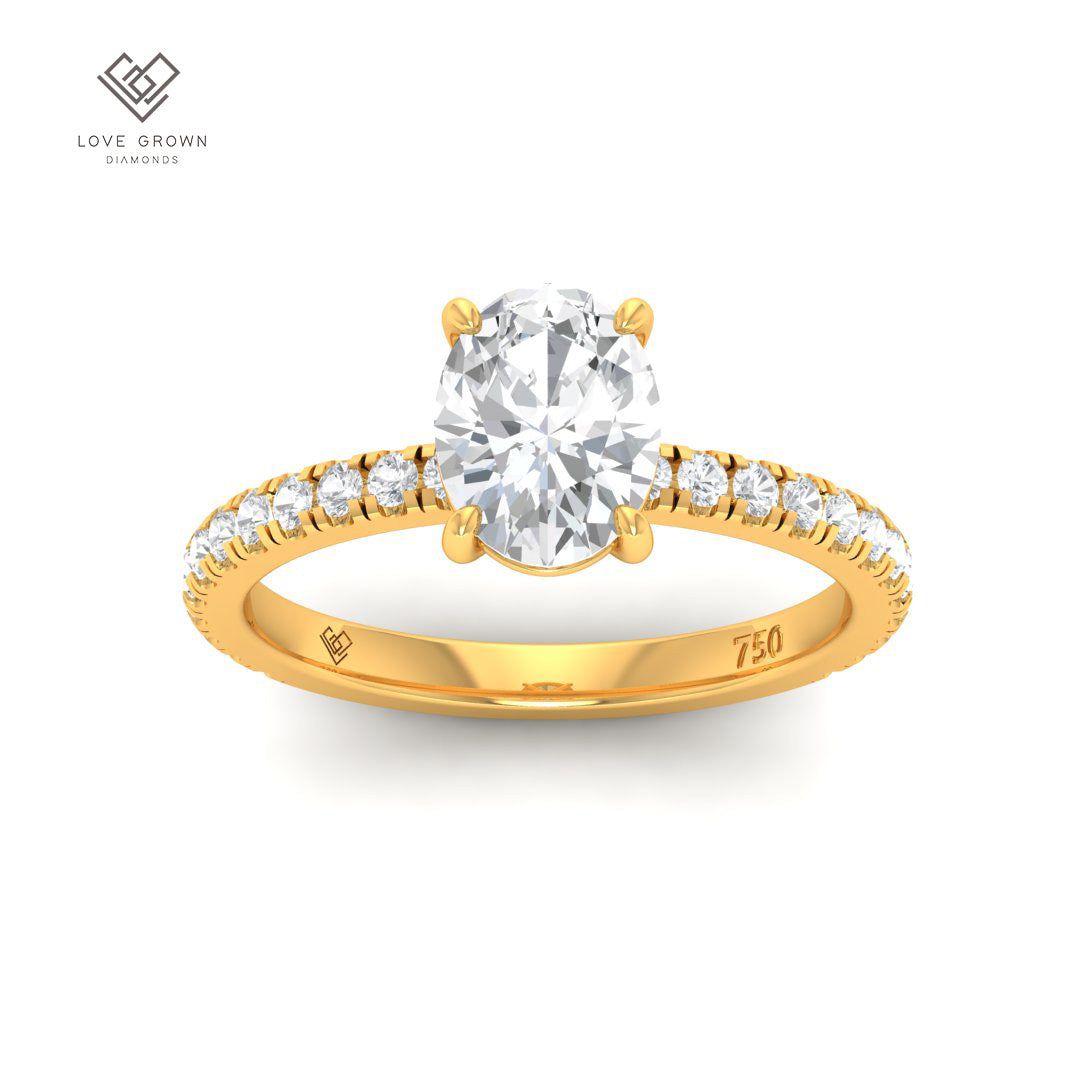 Abigail Oval With Diamond Band Engagement Ring in gold with solitaire and accent diamonds.