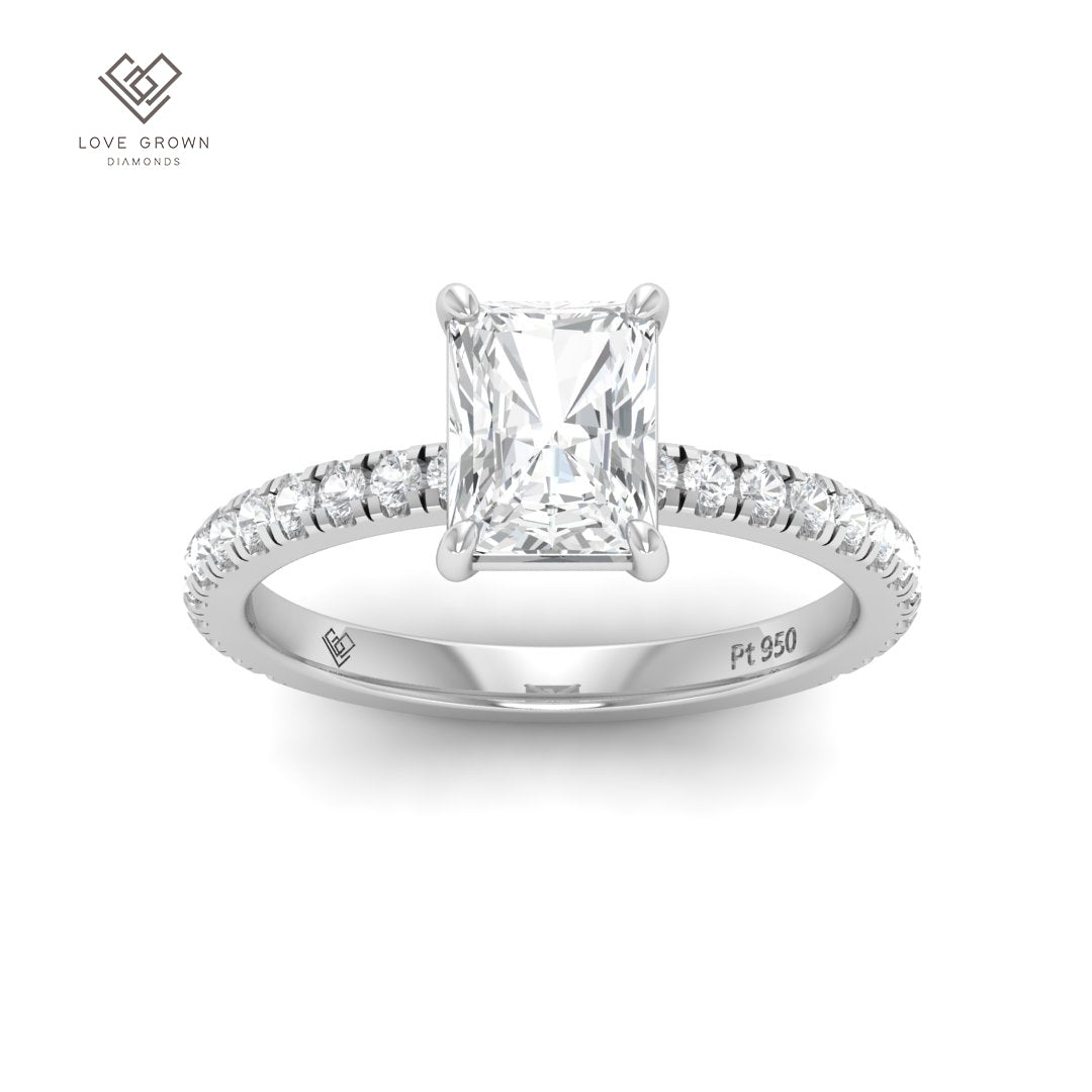 Radiant cut diamond engagement ring with diamond band in platinum setting.