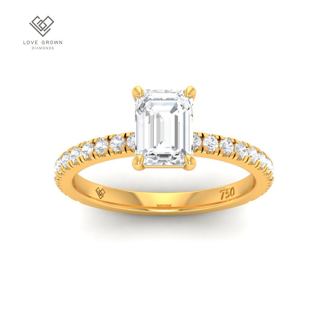 Abigail Emerald With Diamond Band Engagement Ring featuring an emerald cut solitaire and diamond row in a platinum mount.