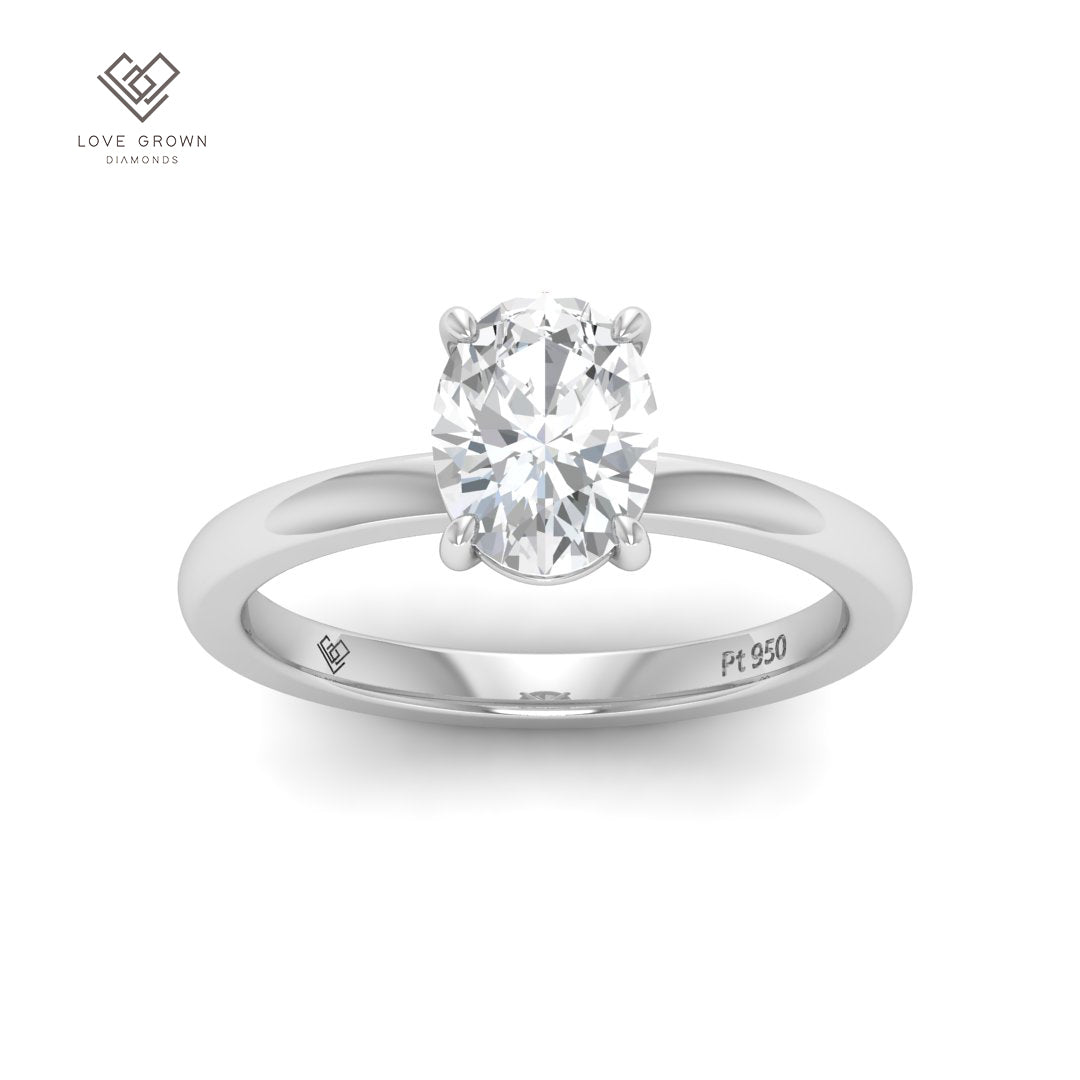 Oval cut diamond engagement ring on platinum band by Noémie.