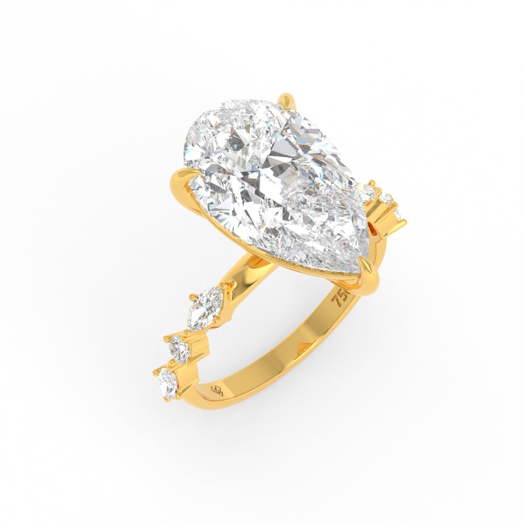 Elizabeth Pear Cut Diamond Engagement Ring With A Marquise And Round Cut Diamond Band