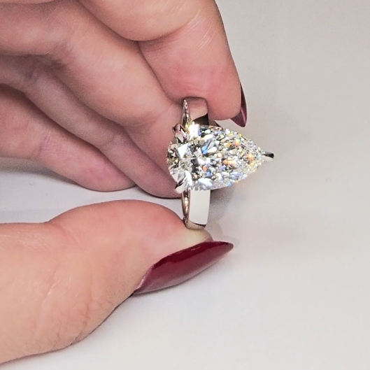 Celeste Pear cut Lab Diamond with Cigar band and half set Diamond sides & hidden halo