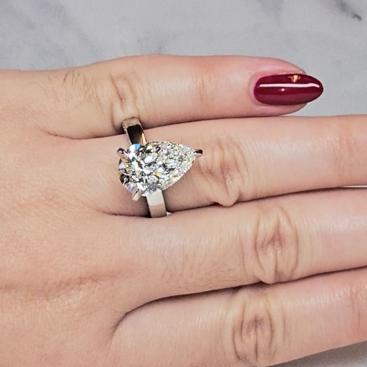 Celeste Pear cut Lab Diamond with Cigar band and half set Diamond sides & hidden halo